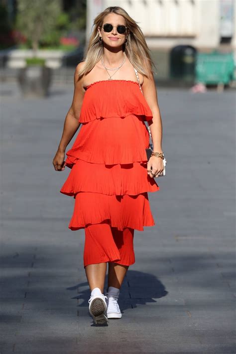 Vogue Williams - In orange dress at the Heart Radio Studios in London ...