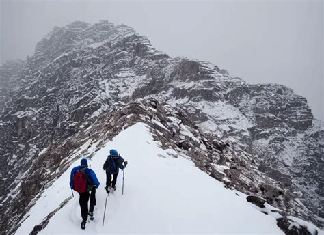 two men hiking up a massive stoney mountain in the | Stable Diffusion ...