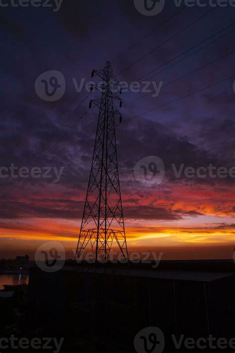 High voltage power line tower with beautiful sky at sunset, stock photo ...