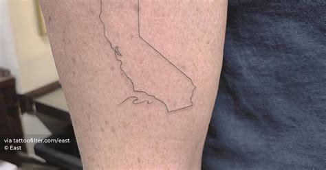 Single needle California Map tattoo on the upper arm.