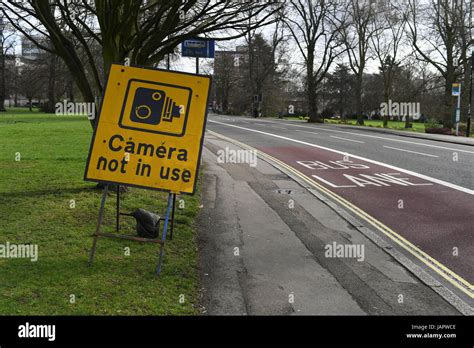 Bus lane traffic camera not in use sign Stock Photo - Alamy