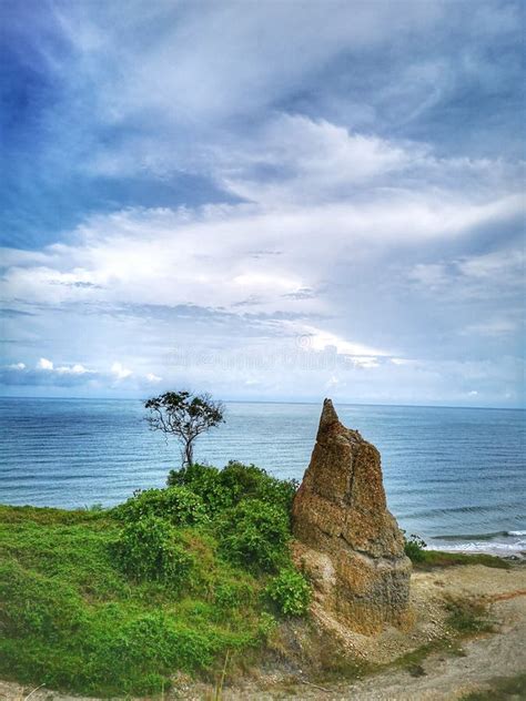 A Beautiful Rock Formation and Silky Smooth Water Reflection on Beach. Stock Image - Image of ...