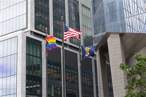 Pride Flag Flying Along Side The American Flag And New York State Flag Stock Photo - Download ...
