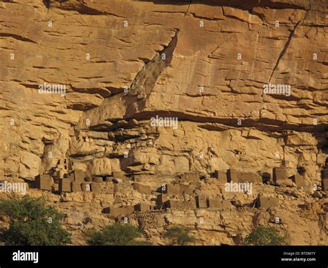 Cliff dwellings along the base of the Bandiagara escarpment Stock Photo ...