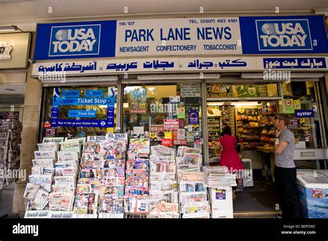 Newsagent kiosk selling Arabic language newspapers, Park Lane, London ...