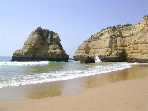 Free photo: Rocky Cliff Near Calm Sea Under Gray Cloudy Sky - Beach, Water, Tropical fruit ...