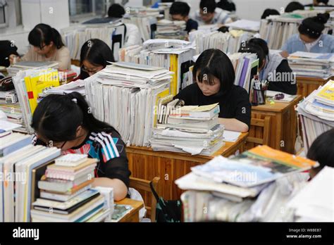 Chinese students review textbooks in preparation for the upcoming National College Entrance Exam ...