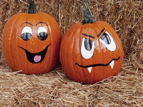 Faces painted on two pumpkins | Cute pumpkin faces, Pumpkin faces, Pumpkin decorating