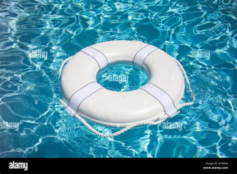 Life Preserver in pool life jacket Stock Photo - Alamy