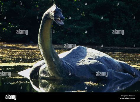 United Kingdom Scotland Loch Ness statue of the monster Nessy in water ...