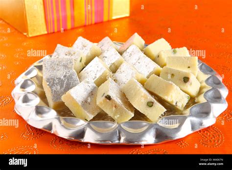 Plate of khoya barfi Stock Photo - Alamy