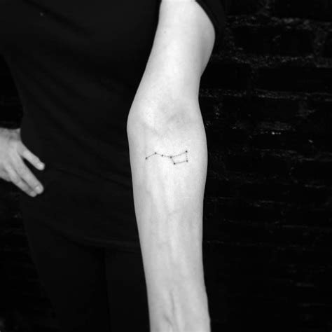 a person with a small tattoo on their arm