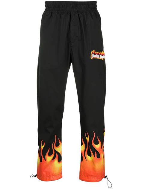 Palm Angels flame print track pants - Black | Flame pants, Pants ...