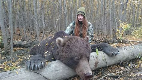 Female trophy hunter poses with slaughtered bears and boasts about skinning them - Mirror Online