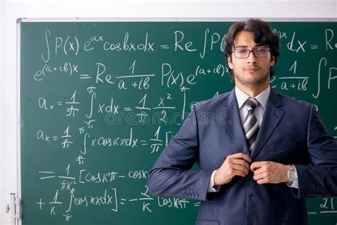 The Young Male Math Teacher in Classroom Stock Photo - Image of lesson, explaining: 140776446