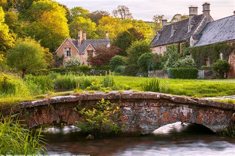 Footbridge, River Eye, Upper Slaughter, Cotswolds, Gloucestershire, England - The village is ...