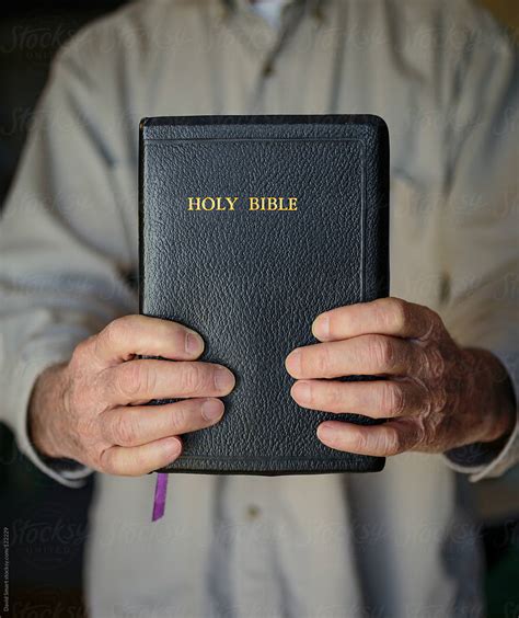 «Hands Holding A Bible» del colaborador de Stocksy «David Smart» - Stocksy