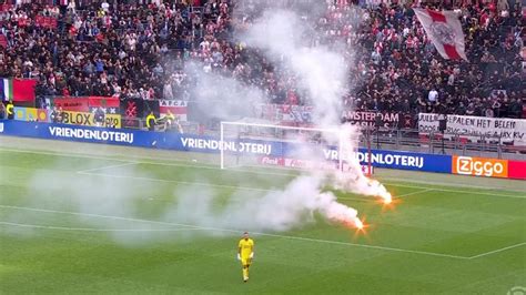 Ajax vs Feyenoord abandoned after flares thrown on to pitch at Johan ...