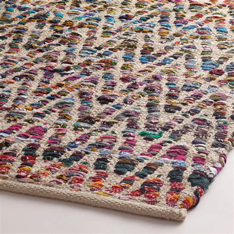 Featuring a chevron design in a rainbow of bright colors, our unique area rug is handwoven from ...