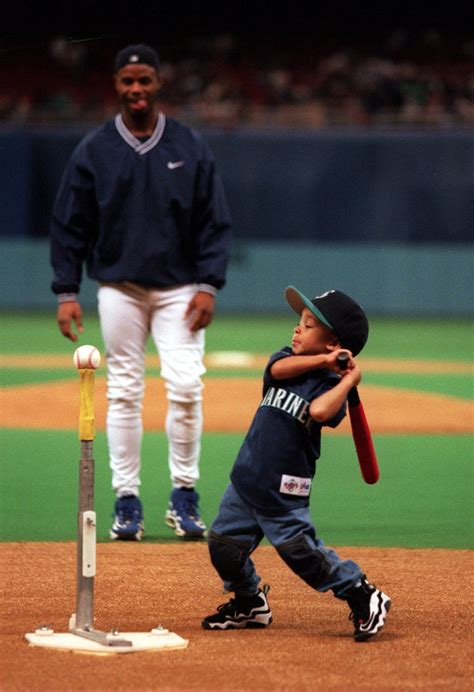 Ken Griffey Jr. with his 2-year-old son, Trey, in the Kingdome on Sept ...