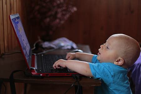 Royalty-Free photo: Black laptop computer, wireless mouse, tablet computer, and yellow ...