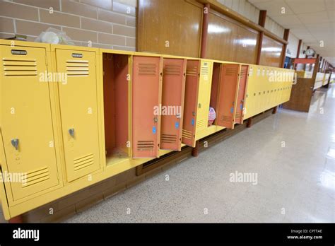 Empty lockers in hallway of elementary school will become a charter school next school year ...