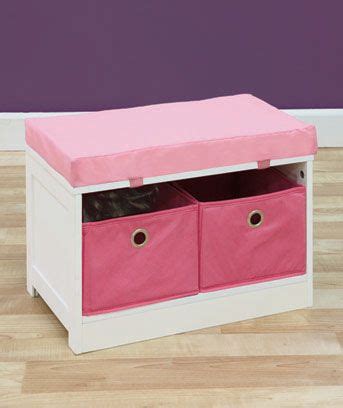 a pink and white storage bench with two bins