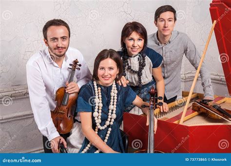 Classical Music Quartet Posing after the Concert. Stock Image - Image of lifestyle, black: 73773865