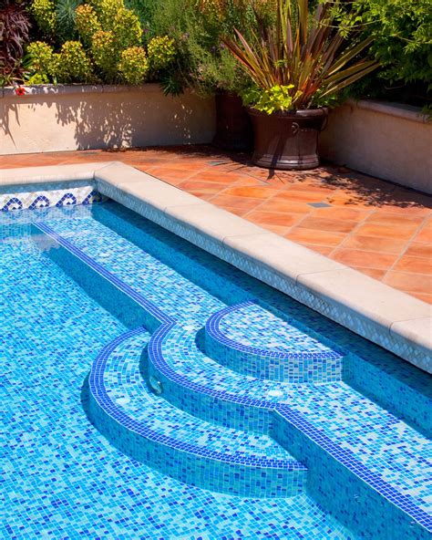 ALKA POOL - The vibrant blue mosiac tile in the pool contrasted against the terracotta pa ...