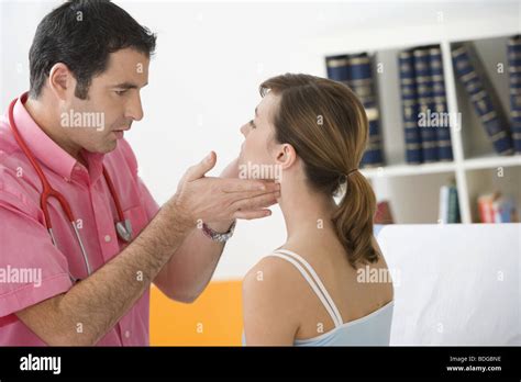 WOMAN PALPATING LYMPH NODE Stock Photo - Alamy