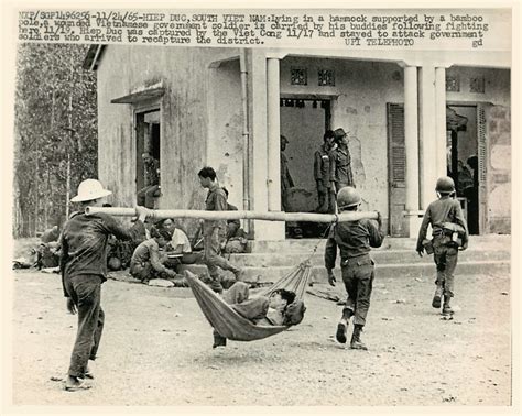 1965 Wounded Vietnamese Soldier Carried by Buddies at Hiep… | Flickr