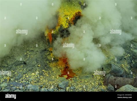 Molten sulfur dripping from pipes at Kawah Ijen volcano, East Java, Indonesia Stock Photo - Alamy