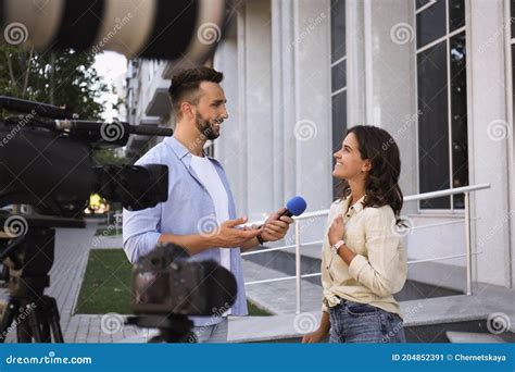 Professional Journalist Taking Interview in Front of Video Cameras ...