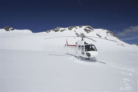 Helicopter Landing on Snowy Mountain Top Stock Photo - Image of extreme, airways: 31829896