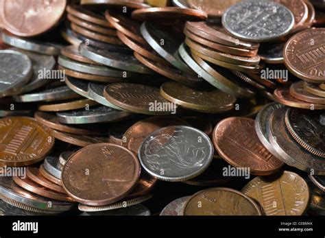 a large pile of assorted US coins Stock Photo - Alamy