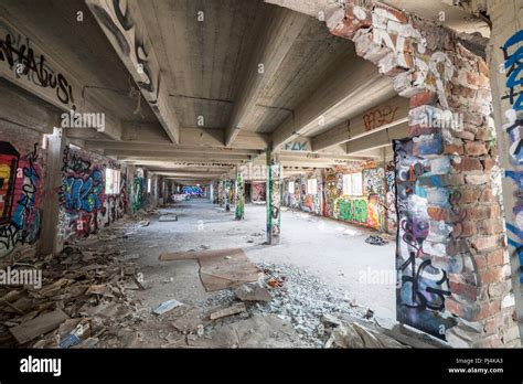 Old abandoned factory hall and graffiti Stock Photo - Alamy