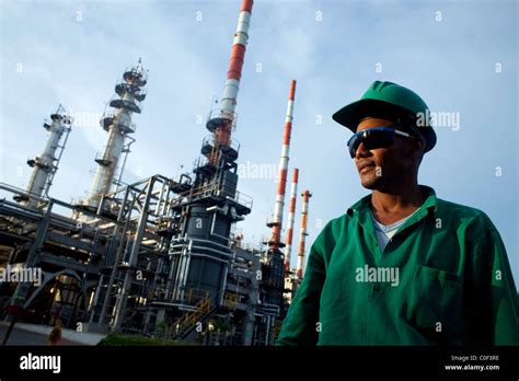 Men work at an oil refinery in Barrancabermeja, Colombia Stock Photo ...