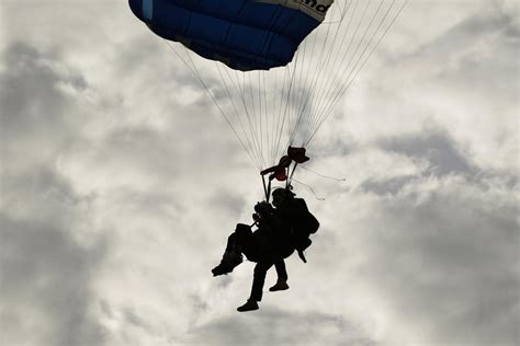 Texas governor skydives for first time alongside 106-year-old World War ...