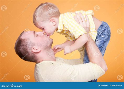 Happy father kiss his son stock image. Image of active - 19045833