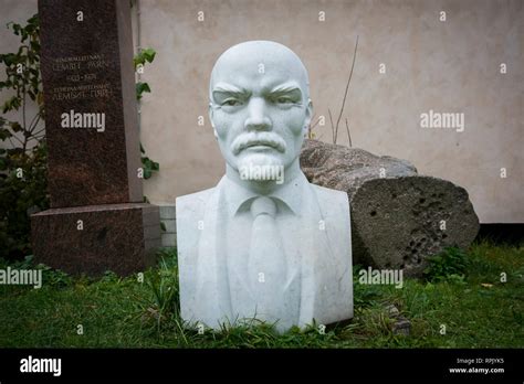 A white marble bust of Vladimir Lenin sits behind a building in Tallin, Estonia Stock Photo - Alamy