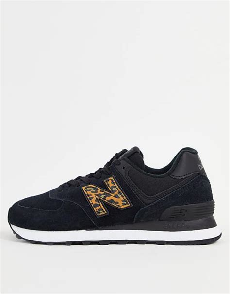 New Balance 574 sneakers in black and leopard print | ASOS