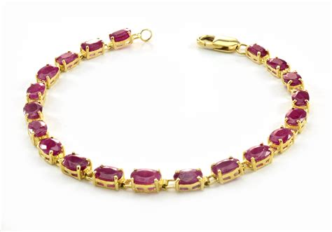 $1,499 Retail 14K Yellow Gold Oval Shaped Beautiful Ruby Tennis Bracelet | Property Room