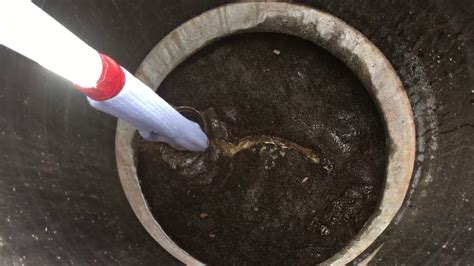 How to check the sludge level in your septic tank with a sock. - YouTube