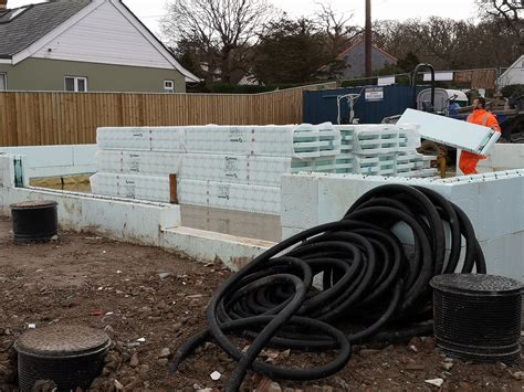 Nudura ICF - unloading and stacking it inside the house, but making ...