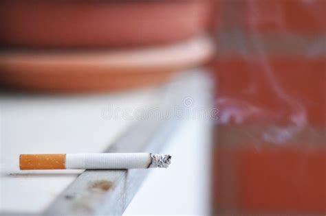 Lit cigarette stock photo. Image of burning, stress, cigarette - 14357240