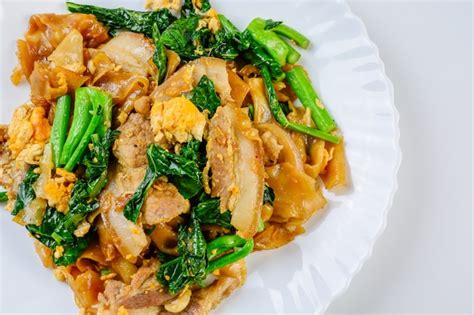 Premium Photo | Stir fried fresh rice flour noodles with sliced pork ...