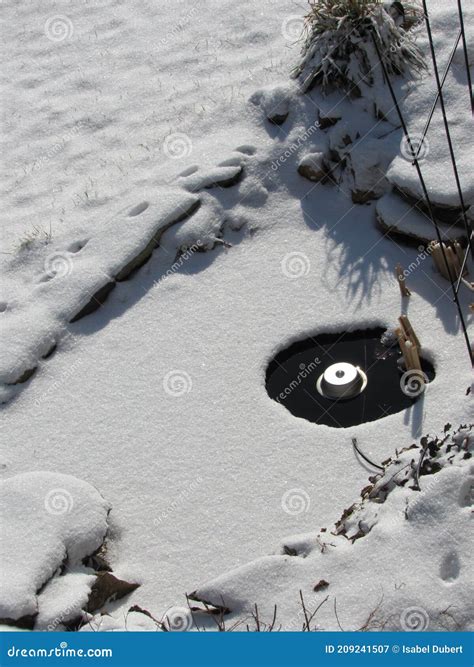 Small Pond with an Electric Heater To Melt the Ice Stock Image - Image ...