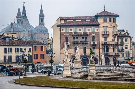 Prato della Valle with the daily market and the domes of the Basilica ...