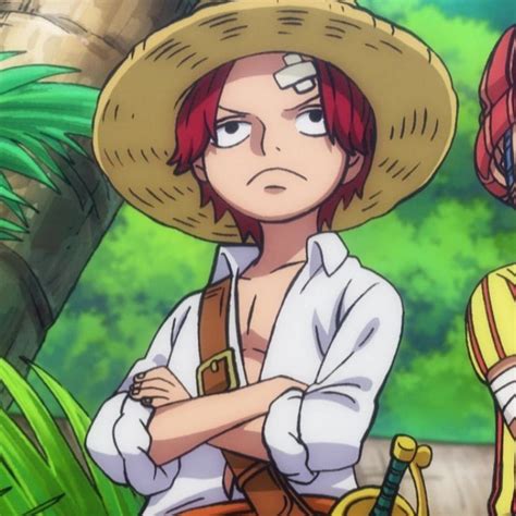 an anime character with red hair wearing a straw hat