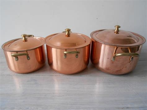 3 beautiful copper cooking pots with lid and brass handles. - Catawiki